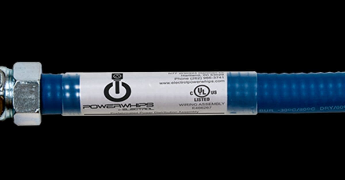 A close-up of blue flexible electrical conduit with a metal connector and printed label on a black background.