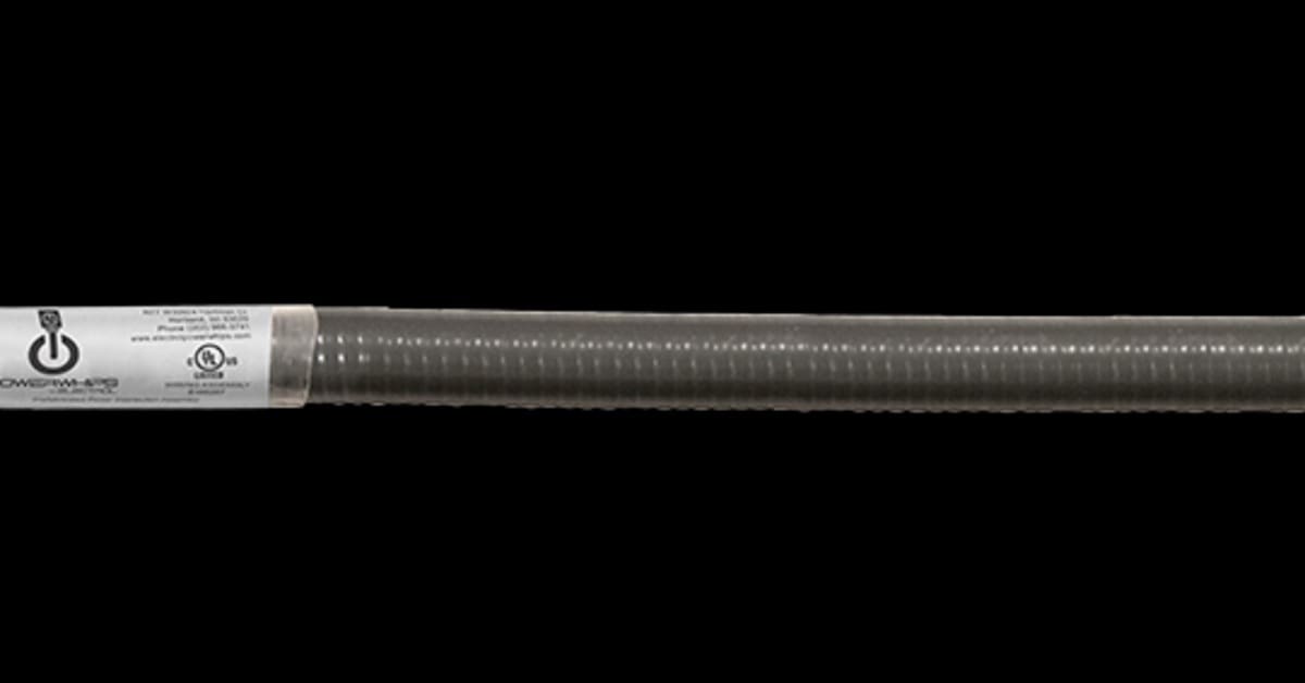 A yellow Russellstoll electrical connector attached to a flexible metal conduit with red, green, and blue wires extending from one end.