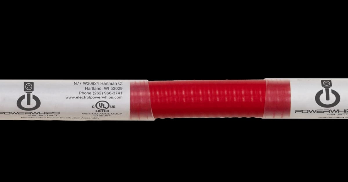 A silver metal electrical box attached to a red flexible conduit with labels and colored wires extending from one end.